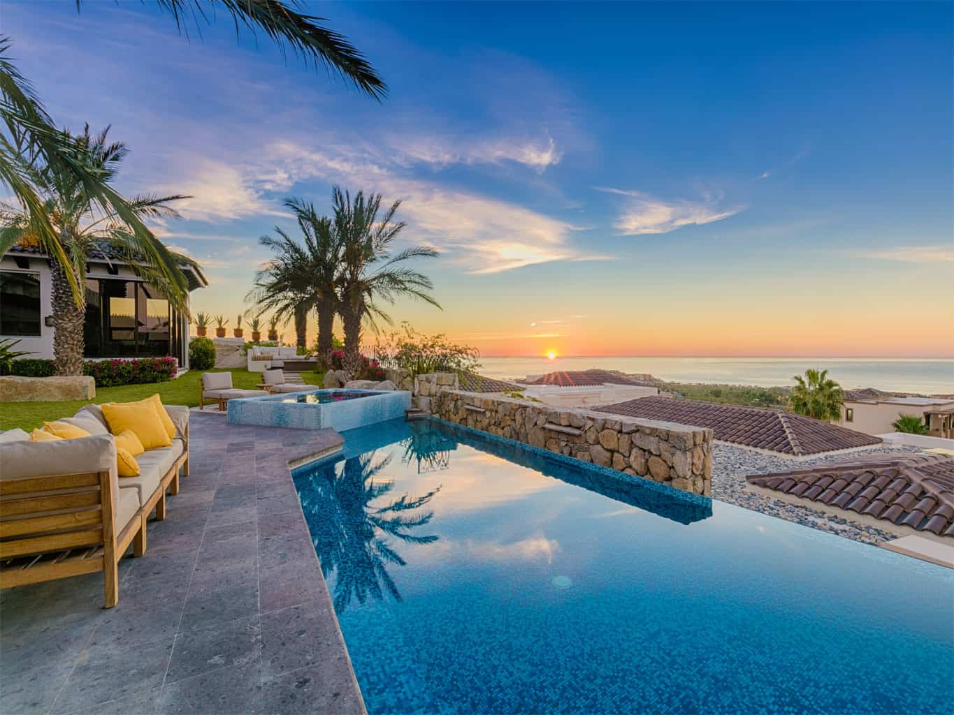 Beachfront home in los cabos and sunset looking over the pool