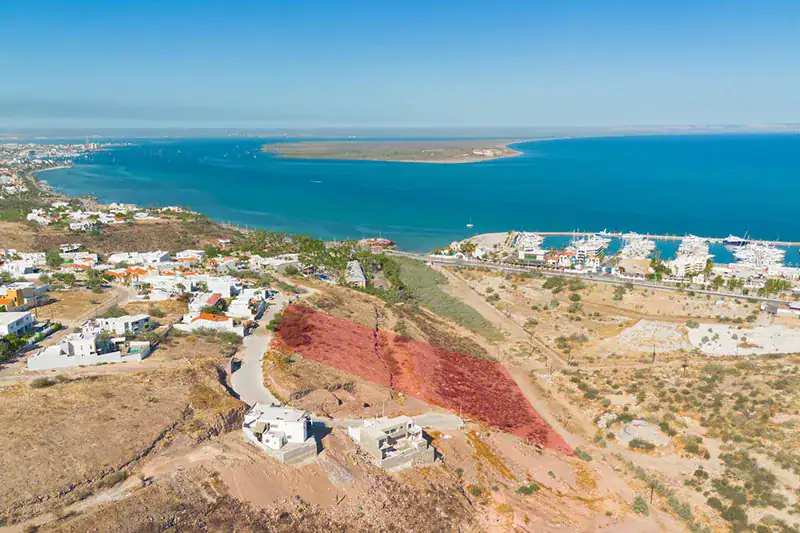Aerial view of hillside homes above the marina and yacht harbour in La Paz, Baja California Sur