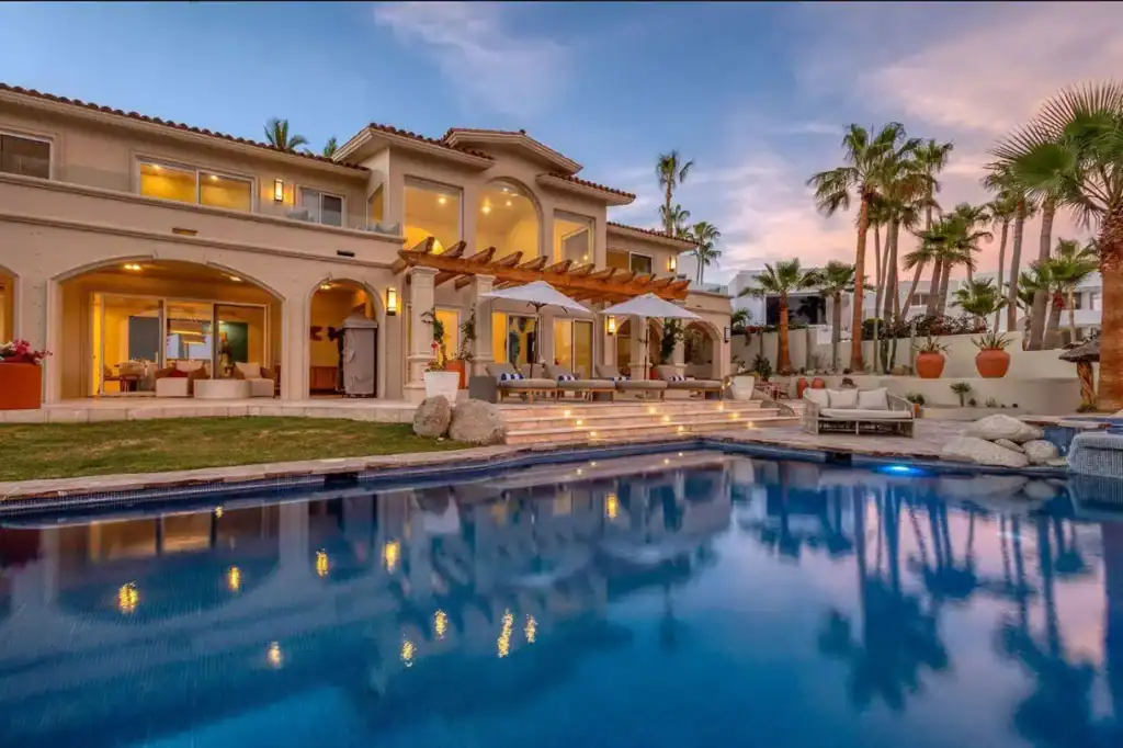 Luxury villa with private pool and outdoor living area at dusk in the Cabo Corridor, Los Cabos, Baja California Sur, Mexico.