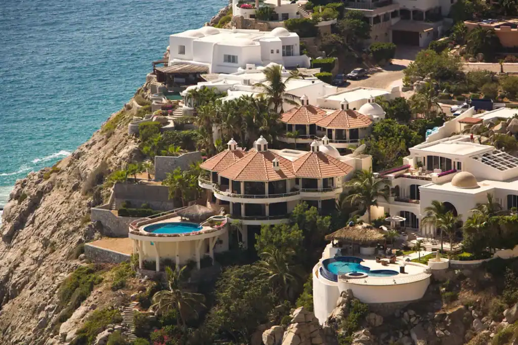 Luxury hillside villas with infinity pools overlooking the Pacific Ocean in Pedregal, Cabo San Lucas, Baja California Sur, Mexico.