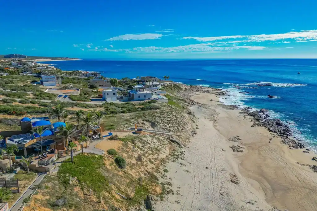 Aerial view of low-density oceanfront residential properties and unspoiled beach along the East Cape coastline of the Sea of Cortez, Baja California Sur, Mexico.